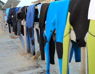 Wetsuits hanging to dry